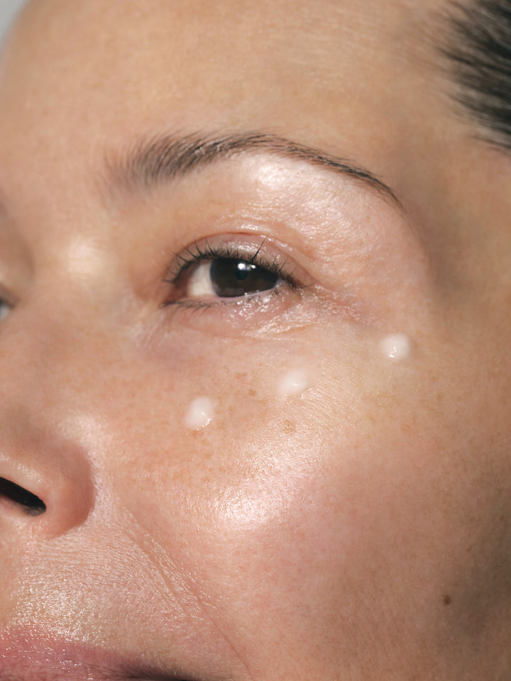 Close up of female's face with SKKN BY KIM Eye Cream Plumping Peptides on skin