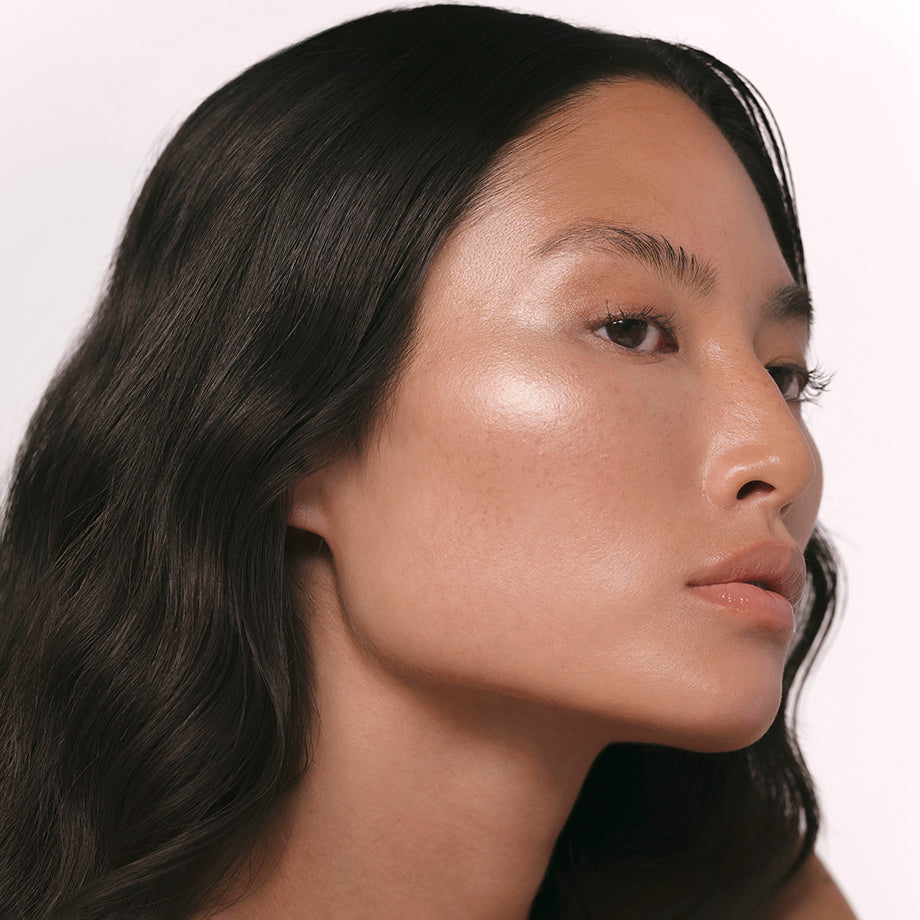 Achieve a soft, ethereal glow with our light dusy peach lip gloss and golden pearl highlighter.