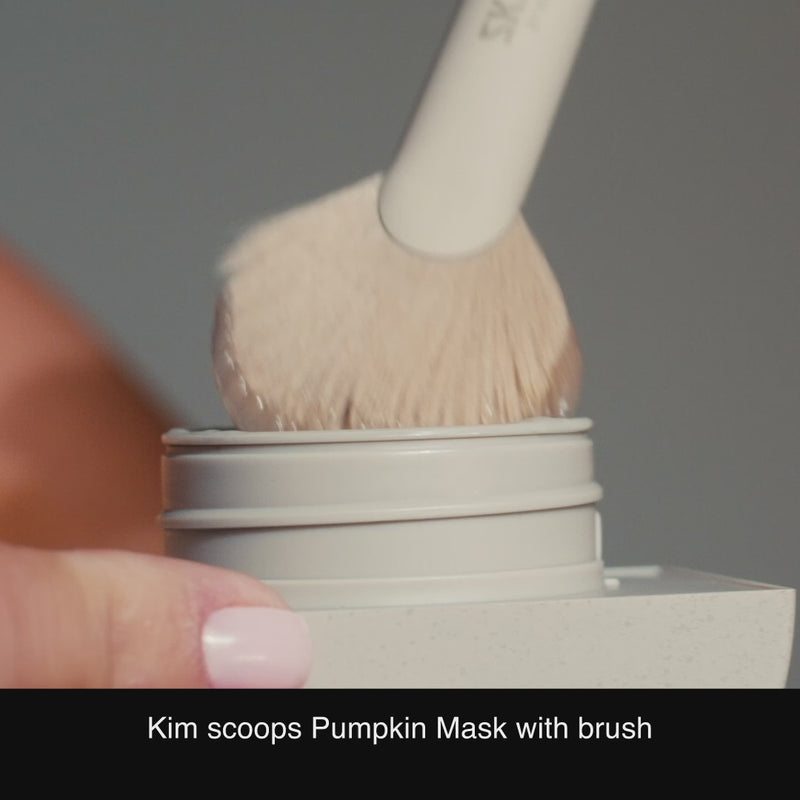 Kim Kardashian applying SKKN BY KIM Resurfacing Mask with Treatment Brush