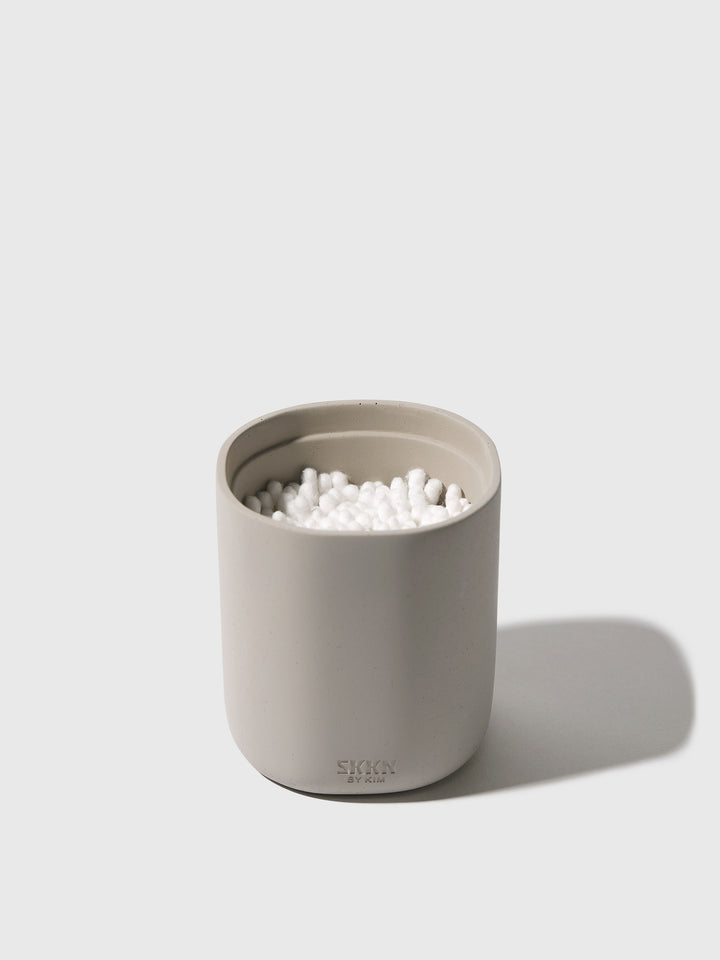 Open view of SKKN BY KIM Canister with cotton swabs inside
