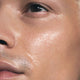 Close up of male's face with SKKN by Kim Night Oil Restoring Treatment on skin