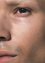 Close up of male's face with SKKN BY KIM Toner Pore Reducing