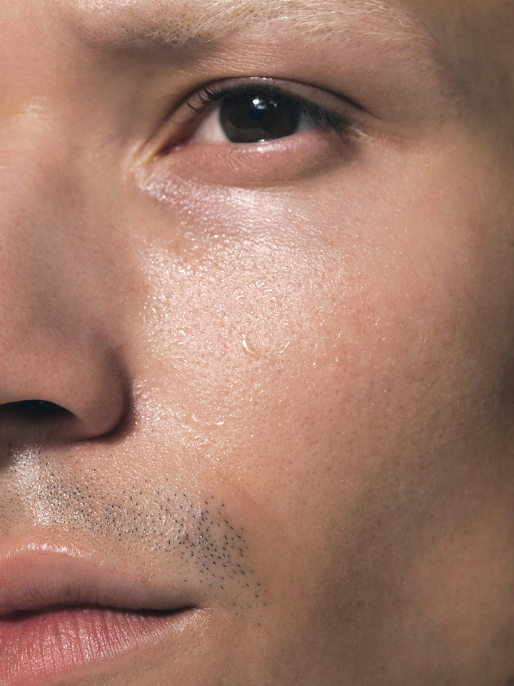 Close up of male's face with SKKN BY KIM Toner Pore Reducing
